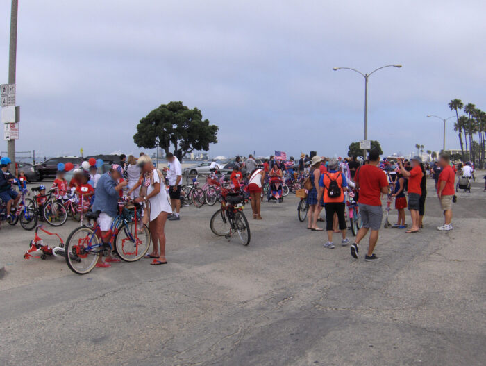 Participants in Great American Kids' Bike Parade register in parking lot