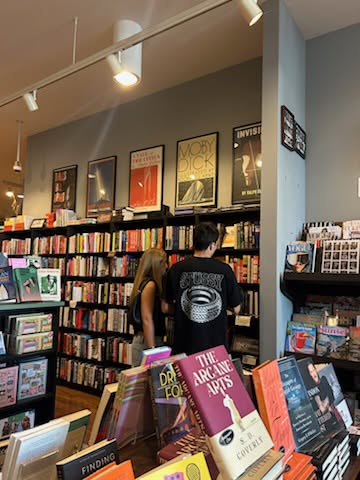 Customers browse filled shelves at Chevaliers, Larchmont Village.